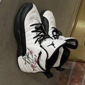 Kids size 13 Jordan’s. White and Black Sneakers with Floral Embroidery